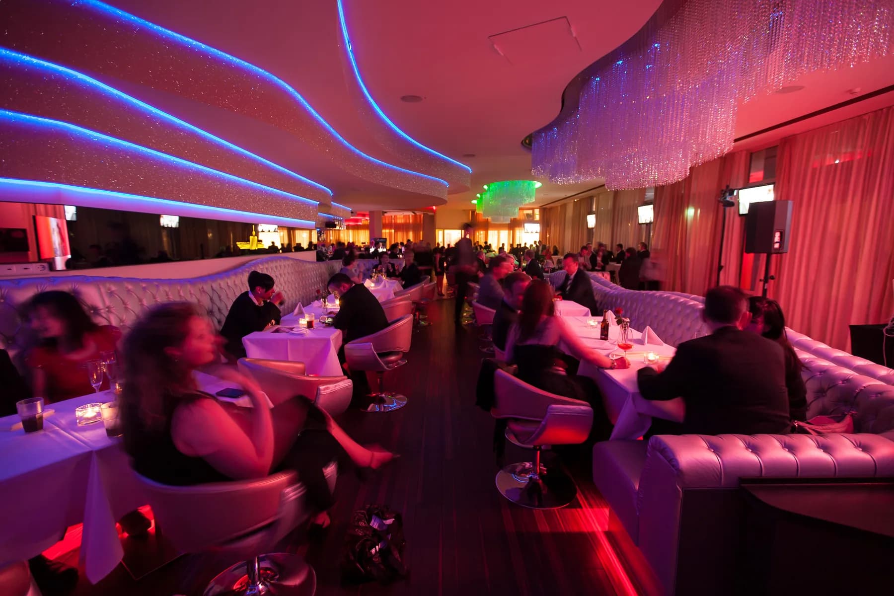 Club area at MIO Berlin with light show and dance floor